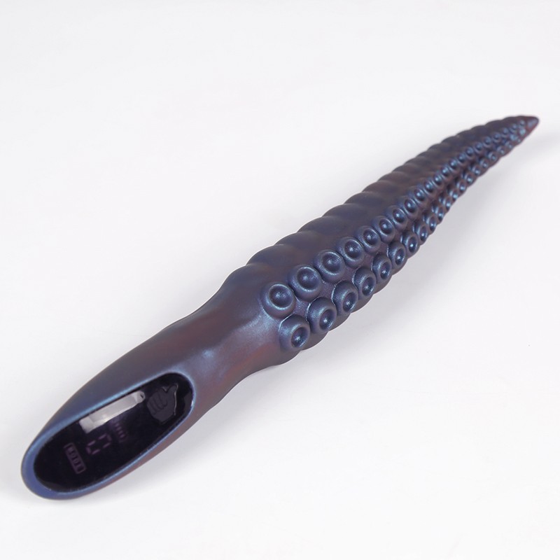 Waterproof Cthulhu-themed vibrator in bathtub for immersive aquatic play