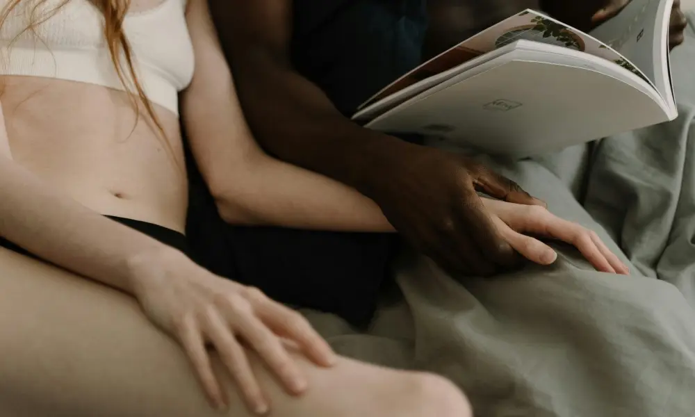 Couple engaging in intimate touch leading to hands-free orgasm