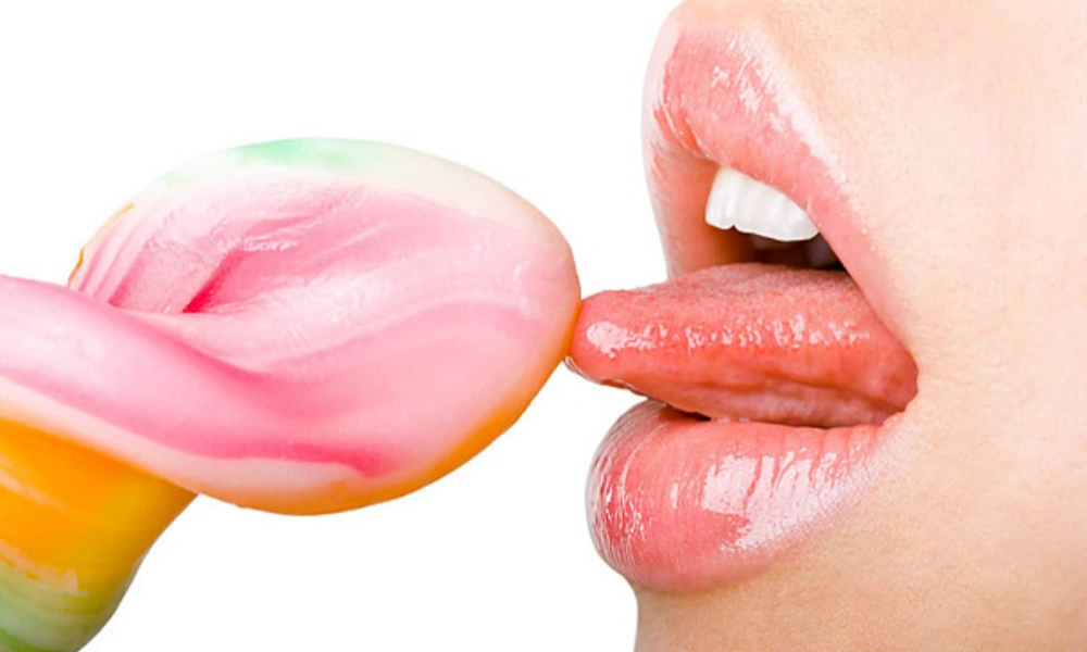 Lollipop Taste as a Flavor Metaphor Person tasting a lollipop as a visual metaphor for flavor perception and oral sensation