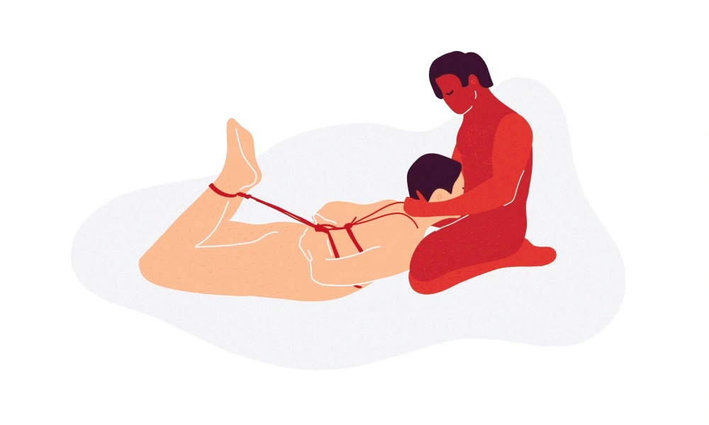 Hogtie bondage position with linked wrist and ankle restraints for experienced users